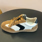Camel and Black Tennis Shoe
